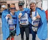  ?? SUBMITTED PHOTO FROM MRS. SPACE CADET ?? Erin Azar, aka Mrs. Space Cadet, poses for a photo after the New York City Marathon with Kim Fassetta from AfterShokz and her sister Christy Fabiano.