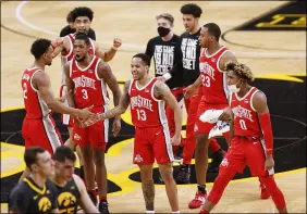  ?? REBECCA F. MILLER — THE ASSOCIATED PRESS ?? Ohio State players celebrate their win against Iowa in Iowa City, Iowa on Feb. 4.