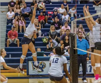  ?? Cory Rubin/The Signal (See additional photos on signalscv.com) ?? West Ranch senior Allison Jacobs goes up for West Ranch High School Tuesday evening. the kill in a Foothill League matchup with Valencia at