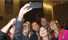  ?? RICH PEDRONCELL­I — THE ASSOCIATED PRESS ?? Assemblyma­n Robert Rivas, D-hollister, center, takes a selfie with other Assembly Democrats after being elected Speaker-designee on Thursday.