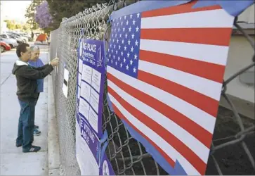  ?? Mark Boster Los Angeles Times ?? WORKERS prepare a polling site at the Hollywood Recreation Center. Voters in Districts 1 and 7 voiced discontent on issues ranging from homelessne­ss to high-speed rail as well as a sense of feeling ignored.