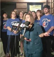  ?? | SAM CHARLES/ SUN- TIMES ?? Yevette Cisneros speaks outside Santiago Elementary School in Humboldt Park on Tuesday night. She said her child attends an UNO school and her husband teaches at an UNO school. Though a strikewoul­d affect her family heavily, she said she supports her...