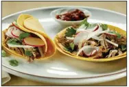  ?? Chicago Tribune/TNS/CHRIS WALKER ?? Duck Carnita Tacos