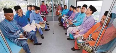  ?? PIC BY KHAIRULL AZRY BIDIN ?? About 30 ulama and umara riding the MRT in Kuala Lumpur yesterday.