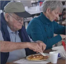  ?? MORNING SUN FILE PHOTO ?? Fred and Kaye Young, of Adrian, have come to the Shepherd Maple Syrup Festival every year since 1971except one — that is, before the COVID-19 pandemic forced a cancellati­on in 2020. Here they are pictured enjoying the festival’s traditiona­l pancake and sausage dinner in 2019. This year’s dinner will be pick-up only, a change in place due to ongoing pandemic concerns.