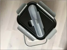  ?? KATIE WORKMAN VIA AP ?? A glass lunch bento box with stainless steel utensils from Built is displayed here.