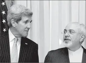  ?? AP/BRIAN SNYDER ?? U.S. Secretary of State John Kerry listens to Iran’s Foreign Minister Mohammad Javad Zarif before resuming talks Monday over Iran’s nuclear program in Lausanne, Switzerlan­d.