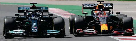  ?? AFP ?? Making his move: Hamilton steers his Mercedes (left) past Verstappen’s Red Bull to put himself in control