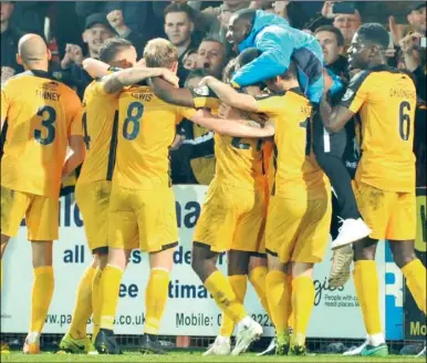  ?? Picture: Steve Terrell ?? Stones players celebrate with their fans after the final whistle