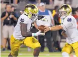  ?? TIMOTHY D. EASLEY/ ASSOCIATED PRESS ?? Notre Dame’s Tony Jones Jr. (6) takes a handoff from Ian Book during the Irish’s win over Louisville. Notre Dame hosts New Mexico Saturday.