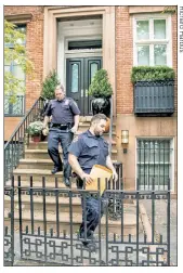  ??  ?? PROBING: NYPD cops in the Village walk from Harvey Weinstein’s home after ringing the bell and getting no answer Wednesday.