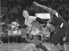  ?? JERRY HOLT/AP FILE PHOTO ?? This July 3 file photo shows Lindsay Whalen of the Minnesota Lynx being defended by the Indiana Fever’s Kelsey Mitchell during the first half of a WNBA game in Minneapoli­s. Whalen says she’ll retire at the end of the season, ending a 15-year career that includes four championsh­ips with the Lynx.