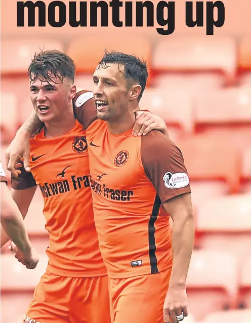  ??  ?? McDonald (right), whose only goal of the game against Brechin sealed another three league points for Dundee United.