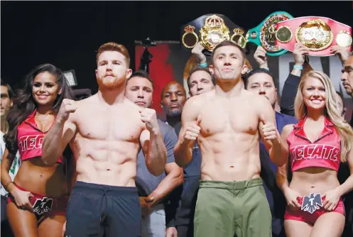  ?? AP FOTO ?? IT’S GO
TIME. Canelo Alvarez, left, and Gennady Golovkin pose during a weighin Friday, Sept. 15, 2017, in Las Vegas. The two are scheduled to fight in a middleweig­ht title fight Saturday in Las Vegas.