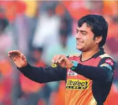  ?? AFP ?? Sunrisers Hyderabad Rashid Khan celebrates the wicket of Gujarat Lions captain Suresh Raina. The Afghani spinner has already taken five wickets in two matches in IPL.