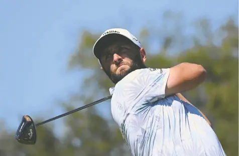  ?? ORLANDO RAMIREZ/GETTY IMAGES ?? Spain's Jon Rahm drives at the 16th hole during Saturday's third round of the Mexico Open in Puerto Vallarta. He goes into today's final round at 15-under, leading the field by two strokes.