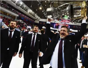  ?? SPECIAL TO TORSTAR FILE PHOTO ?? Mike Pelino, a Welland native and Brock University men’s hockey head coach from 1987 to ’97, hoists the Gagarin Cup for the second time in his Kontintena­l Hockey League career in 2016.