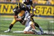  ?? CHARLIE NEIBERGALL / AP ?? Kent State wide receiver Dante Cephas is tackled by Iowa linebacker and Northmont alum Jestin Jacobs (5), whose emergence has been a big part of Iowa’s defensive that ranks seventh nationally in scoring.