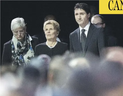  ?? NATHAN DENETTE / THE CANADIAN PRESS ?? Prime Minister Justin Trudeau and Ontario Premier Kathleen Wynne, centre, attend the memorial service Thursday for Barry and Honey Sherman, who were found dead in the indoor pool room of their Toronto home last week.