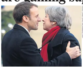  ??  ?? French president Emmanuel Macron and Theresa May on her arrival in Paris yesterday