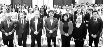  ??  ?? Raymond (front, centre) at the Sabah Digital Economy Symposium 2017 launching ceremony in Tanjung Aru yesterday.