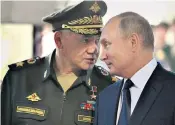  ?? ?? Sergei Shoigu with Vladimir Putin, who has replaced him as the Russian defence minister