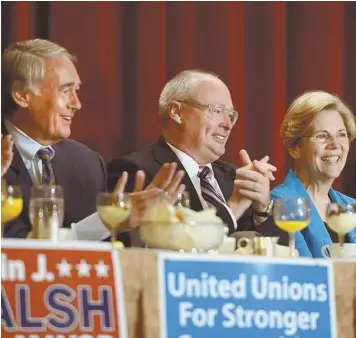  ?? STAFF PHOTO BY TED FITZGERALD ?? LOOKING FOR ANSWERS: U.S. Sens. Edward J. Markey, left, and Elizabeth Warren say they need more details on a possible strike against Syria. The senators attended the Greater Boston Labor Council’s Labor Day breakfast at the Boston Park Plaza Hotel &...