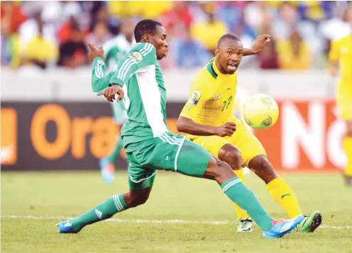  ??  ?? Bernard Parker of South Africa evades challenge from Kunle Odunlami of Nigeria during the 2014 CAF African Nations Championsh­ips (CHAN) Group A football match at Cape Town Stadium, Cape Town on 19 January 2014.