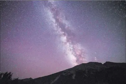  ?? CHASE STEVENS/ LAS VEGAS REVIEW-JOURNAL / FOLLOW @CSSTEVENSP­HOTO ?? The Milky Way is shown over Great Basin National Park in this long exposure photograph taken Wednesday. The park’s observator­y was dedicated Thursday 300 miles northeast of Las Vegas.