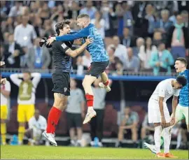  ?? Francisco Seco Associated Press ?? CROATIAN PLAYERS celebrate their semifinal victory over England. Croatia overcame an early 1-0 deficit to advance to the championsh­ip against France.