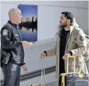  ?? Photo: Julio Cortez. ?? A traveller, second from left, talks to a U.S. Customs and Border Protection official near the exit of the internatio­nal arrivals terminal at Newark Liberty Internatio­nal Airport, Thursday, Oct. 26, 2017, in Newark, N.J. . Long-haul carriers are...