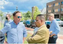  ?? MARK PAZNIOKAS/CT MIRROR ?? Gov. Ned Lamont, from left, Rep. Geraldo Reyes Jr., chair of the Black and Puerto Rican Caucus, and House Speaker Matt Ritter gather at a branch library on Albany Avenue in Hartford.