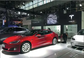  ?? LI FUSHENG / CHINA DAILY ?? Tesla starts to offer vehicles in China featuring LFP batteries in the second half of 2020.