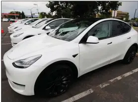  ?? (AP/David Zalubowski) ?? Model Y SUVs are displayed last month at a Tesla dealership in Littleton, Colo. Tesla is deciding where to construct its next electric-vehicle factory, where the company plans to build its Cybertruck pickup and supplement production of the Model Y.