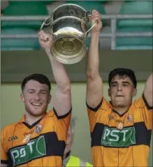  ??  ?? Conor Jordan and Wayne Guthrie of Austin Stacks raise the Seniro Club Championsh­ip cup back in April in Austin Stack Park