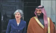  ?? SIMON DAWSON / REUTERS ?? Britain’s Prime Minister Theresa May greets the Crown Prince of Saudi Arabia Mohammad bin Salman outside 10 Downing Street in London on Wednesday.
