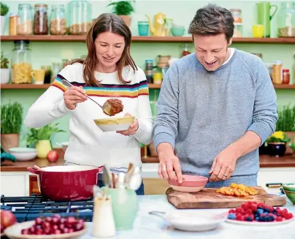  ??  ?? Jamie Oliver in the kitchen with his wife, Jools. They have just had baby No 5, a boy named River Rocket.