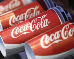  ?? PICTURE: BLOOMBERG ?? IN THE CAN: Coca-Cola has joined the Department of Water and Sanitation and Unilever to support efforts to cut water consumptio­n.