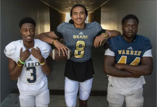  ?? PHOTO BY MICHAEL GOULDING ?? From left, Jordan Ross, Nico Iamaleava and EJ Smith are key players for Warren this season. Last year, the Bears went 8-0in the regular season but lost in the first round of the playoffs.