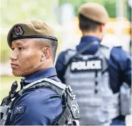  ?? AP ?? Gurkha police officers guard the perimeter of the Shangri-La Hotel in Singapore yesterday ahead of the summit between US President Donald Trump and North Korean leader Kim Jong-Un.