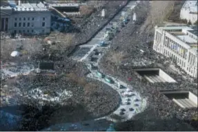  ?? JESSICA GRIFFIN - THE PHILADELPH­IA INQUIRER VIA AP ?? Thousands line the Philadelph­ia Eagles’ Super Bowl victory parade along the Benjamin Franklin Parkway, Thursday, in Philadelph­ia.