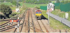  ?? Picture: Steve MacDougall. ?? Engineers rushed to Laurenceki­rk Station to fix the problem which affected commuters like Matt Tessmer and partner Claire Don, below.