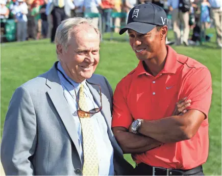  ?? TONY DEJAK/AP ?? In this June 3, 2012, file photo, Jack Nicklaus, left, talks with Tiger Woods after Woods won the Memorial Tournament at Muirfield Village Golf Club in Dublin, Ohio, for the fifth time.