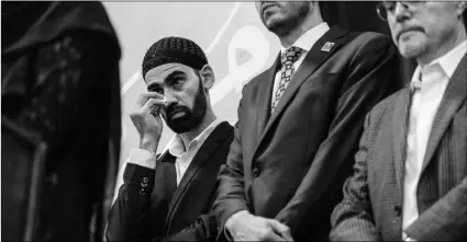  ?? DANIEL KIM/THE SACRAMENTO BEE VIA AP ?? In this Aug. 11, 2019, file photo, Hamid Hayat wipes tears as he stands with his legal team, and family members during a news conference Sunday that coincided with an Eid al-Adha celebratio­n, in Sacramento.