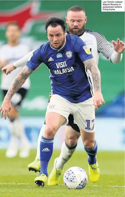  ??  ?? Lee Tomlin robbed Wayne Rooney in possession before firing home