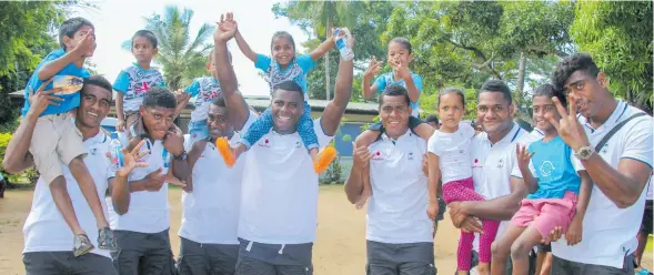  ??  ?? Vodafone Fijian Under-20 players with orphans at Treasure Home in Nadi on November 27, 2017. Photo: Anushil Kumar of Vodafone Fiji.