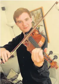  ?? PICTURES: ALISTAIR WILSON
AN144509 ?? Violinist Tom Balch, of Fleet, who recently played at Guildford Cathedral.