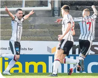  ??  ?? Dunfermlin­e’s Nicky Clark celebrates his goal