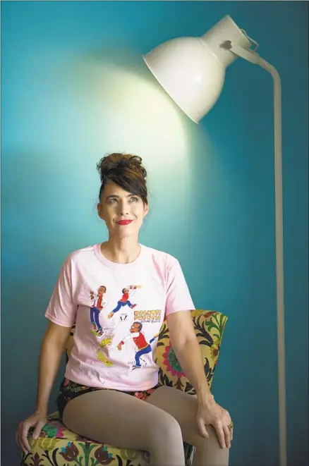  ?? Francine Orr Los Angeles Times ?? KATHLEEN HANNA models a T-shirt, this one featuring author-musician Brontez Purnell, that funds the educationa­l project.