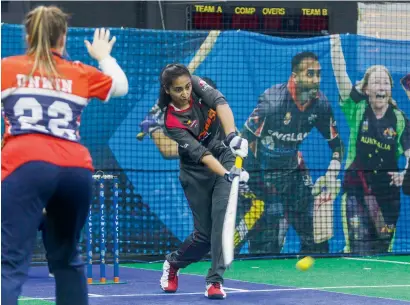  ?? Photo by Neeraj Murali ?? Esha Oza of the UAE in action during the Indoor Cricket World Cup match against England in Dubai. —